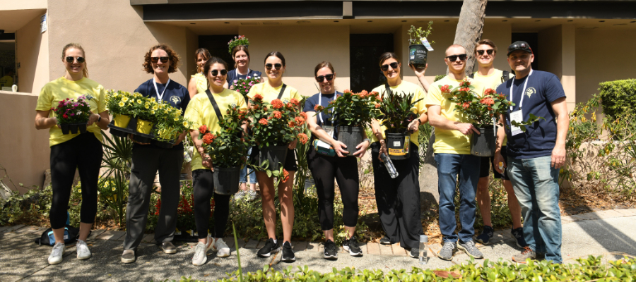 NCA Coffee Gives Back Day of Service Volunteers Planting Flowers, Tampa 2023